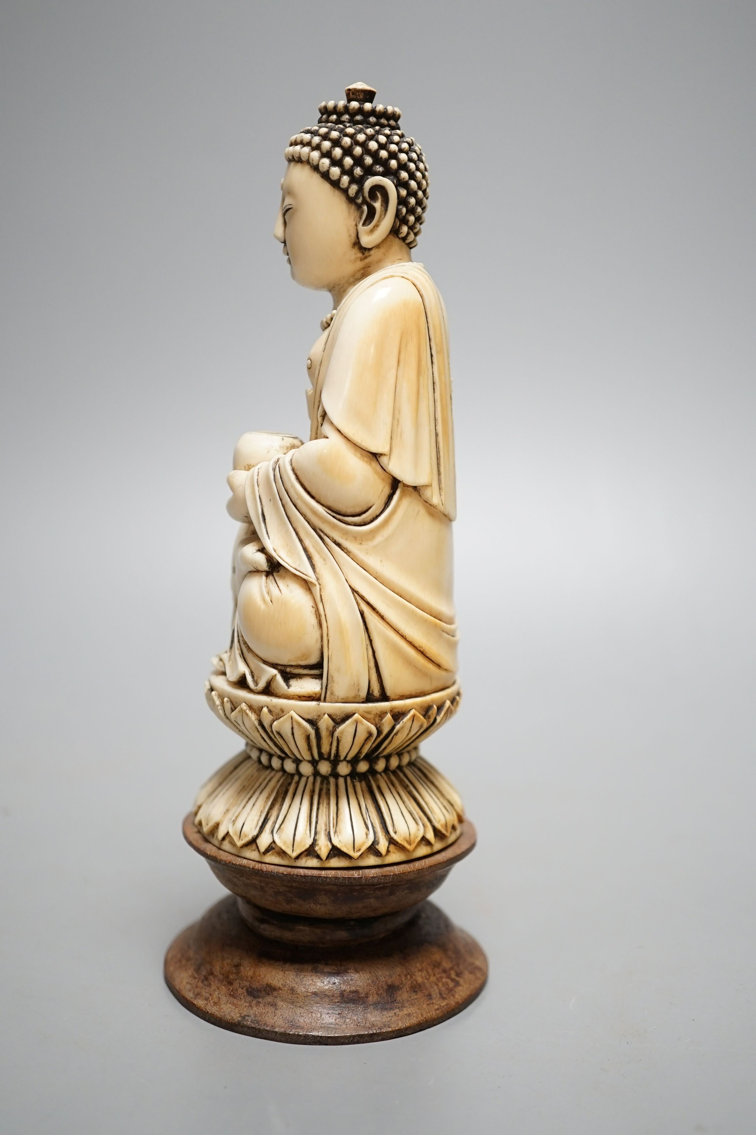 A 19th century Chinese ivory seated figure of Buddha Shakyamuni - 19cm tall